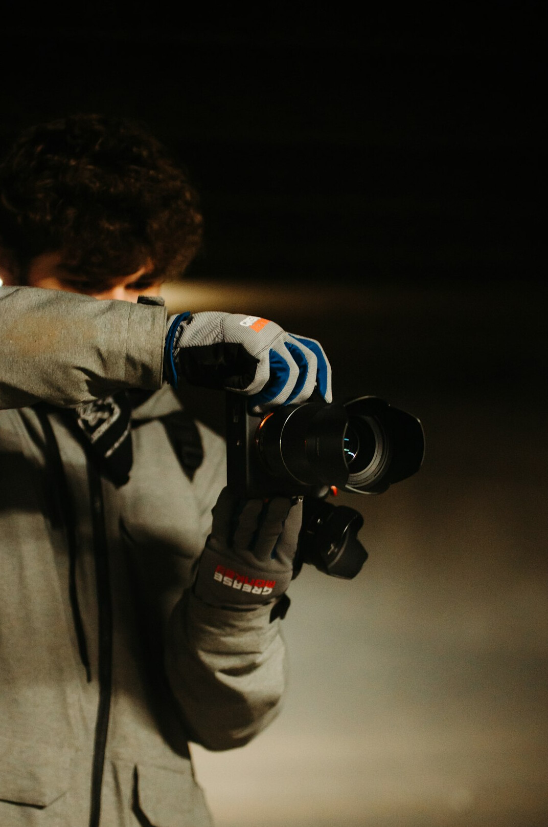 Camera operator filming inside a television studio